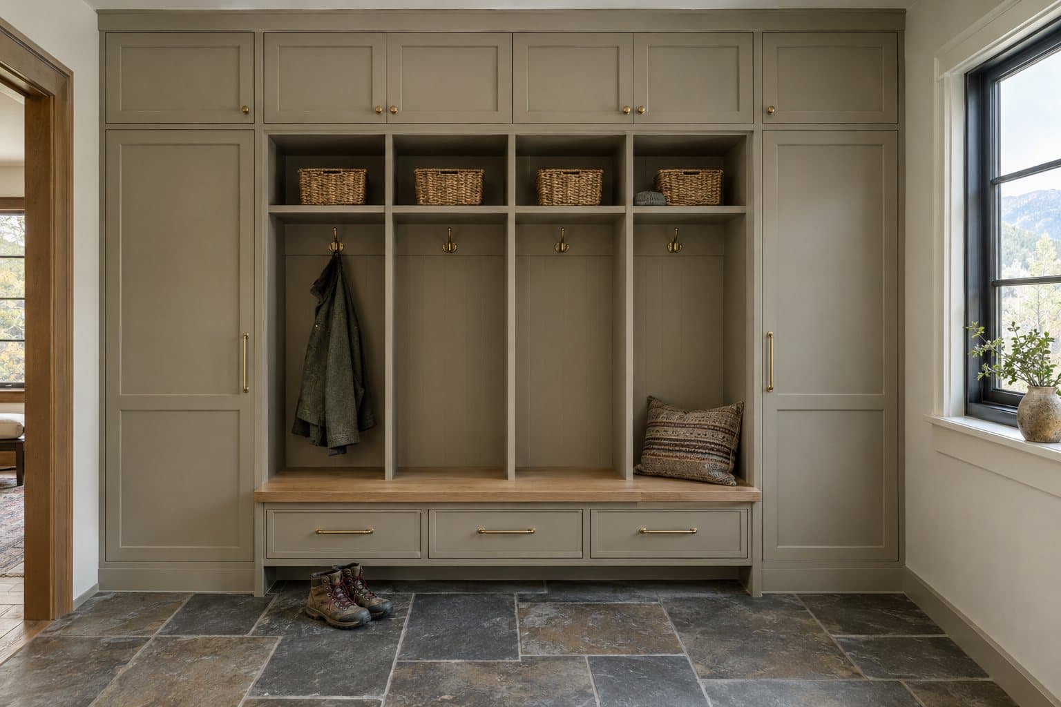 Painted mudroom built-in with bench, cubbies and tall cabinets